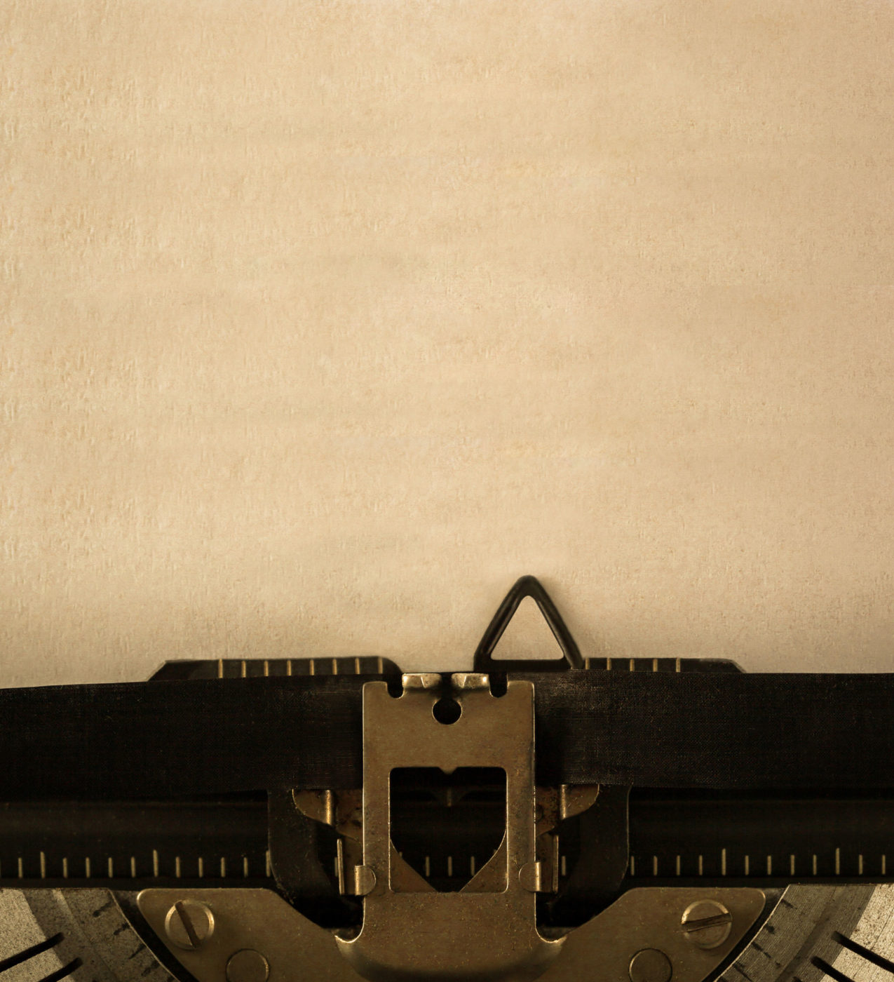 Old typewriter using old golden paper